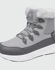 Dannto women‘s light gray winter snow Boots shown at a side angle