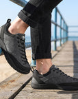 Dannto Veld I - Men's and Women's Wide Toe Box Barefoot Shoes gray shown being worn on a seaside wooden pier