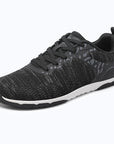 Gliss II Pro - black wide toe box barefoot shoes for women shown from a three quarter view
