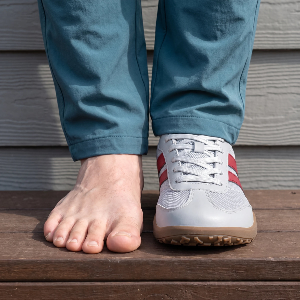 Dannto Frond - Non-Slip Zero Drop Barefoot Sneakers light gray shown on one foot beside a bare foot to demonstrate the wide toe box