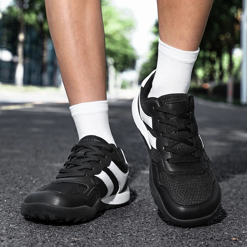 Dannto Mesh Wide - Toe Barefoot Shoes black shown being worn while standing outdoors