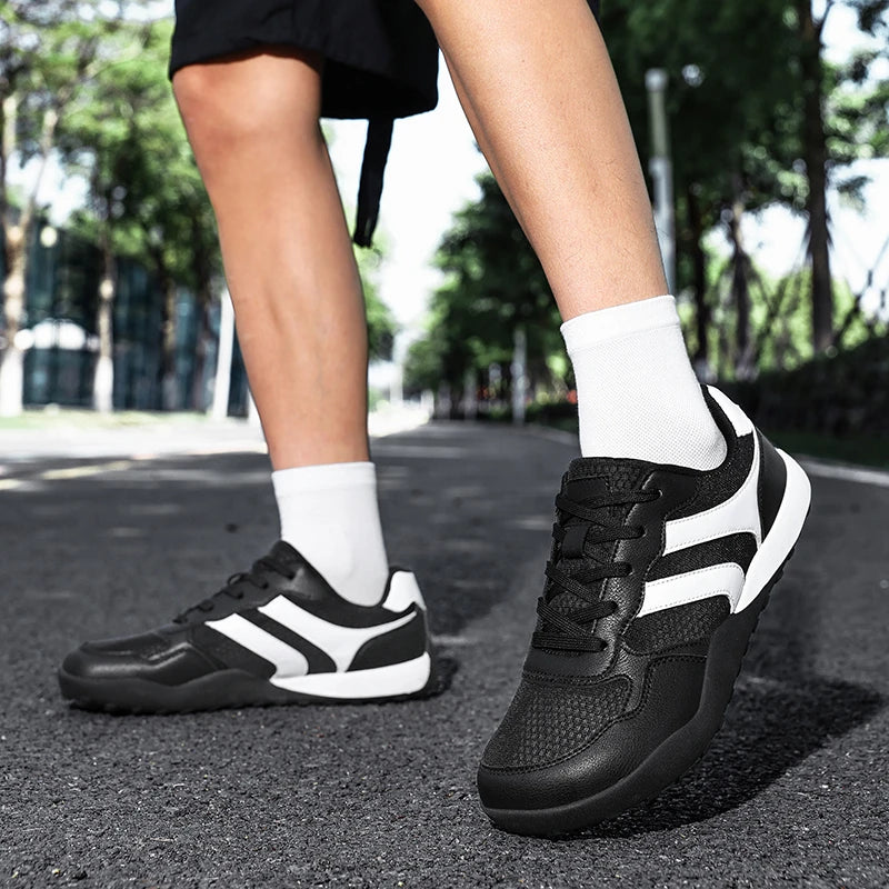 Dannto Mesh Wide - Toe Barefoot Shoes black shown being worn while walking outdoors