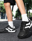 Dannto Mesh Wide - Toe Barefoot Shoes black shown being worn while walking outdoors