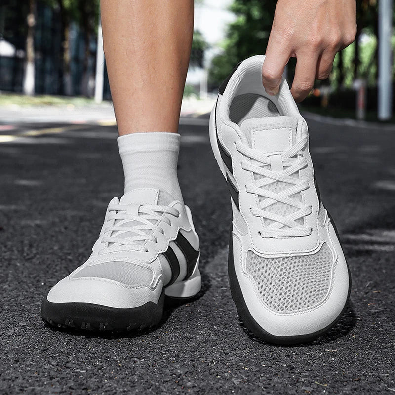 Dannto Mesh Wide - Toe Barefoot Shoes white shown being put on outdoors
