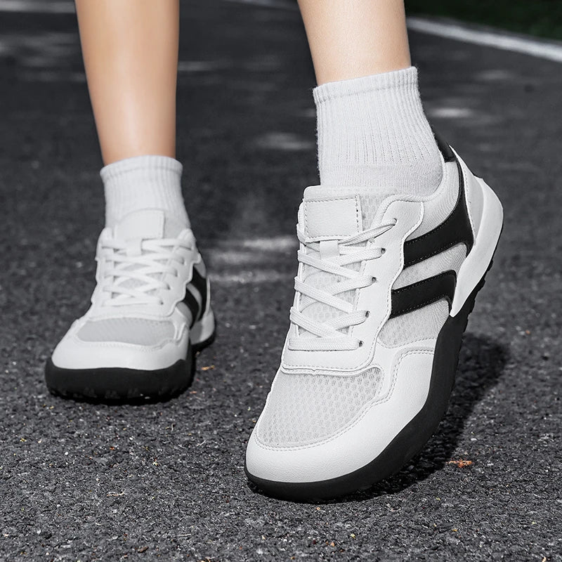 Dannto Mesh Wide - Toe Barefoot Shoes white shown being worn outdoors from the front