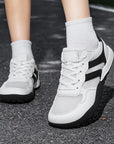 Dannto Mesh Wide - Toe Barefoot Shoes white shown being worn outdoors from the front