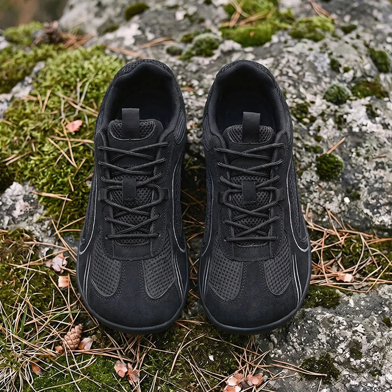 Dannto Aero N1 - 3E Wide Mesh Barefoot Shoes black pair shown from above on moss and rocks