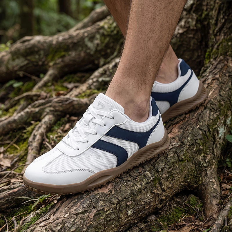 Dannto Frond - Non-Slip Zero Drop Barefoot Sneakers white shown being worn while walking over tree roots outdoors
