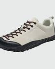 Dannto beige barefoot trail shoes shown from a three quarter view