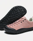 Dannto pink barefoot trail shoes shown from a three quarter view and the bottom