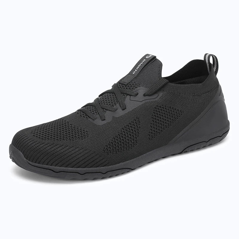 Dannto black zero drop barefoot sneakers shown from a three quarter view