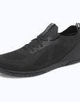 Dannto black zero drop barefoot sneakers shown from a three quarter view