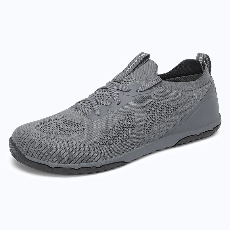 Dannto dark gray zero drop barefoot sneakers shown from a three quarter view