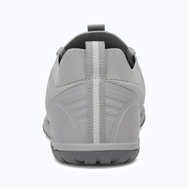 Dannto dark mid zero drop barefoot sneakers shown from the back
