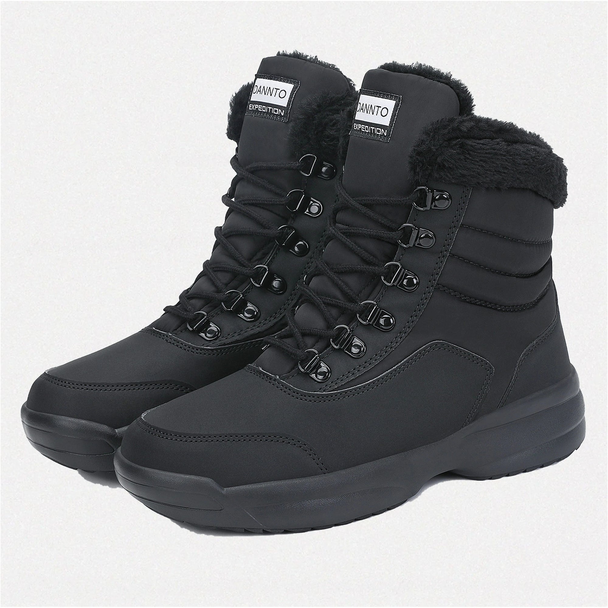 two Dannto women‘s black winter snow Boots shown at a side angle