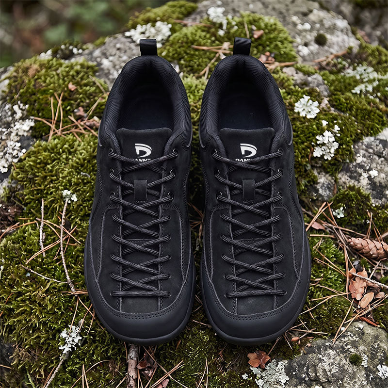Dannto Veld I - Men's and Women's Wide Toe Box Barefoot Shoes black pair shown from above on moss-covered 