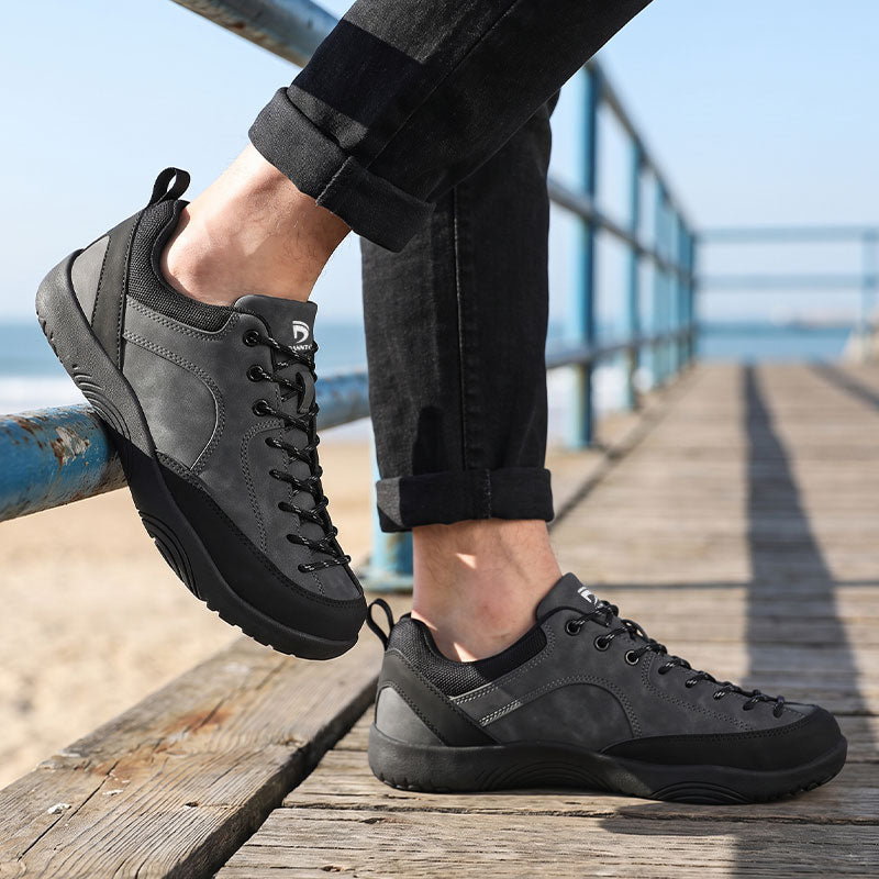 Dannto Veld I - Men's and Women's Wide Toe Box Barefoot Shoes gray shown being worn on a seaside wooden pier