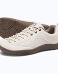 Dannto Veld I - 3E wide toe box barefoot shoes beige shown from a three-quarter view with the outsole visible