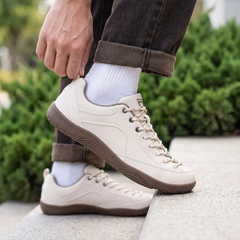 Dannto Veld I – 3E wide toe box barefoot shoes Beige, worn while stepping outdoors