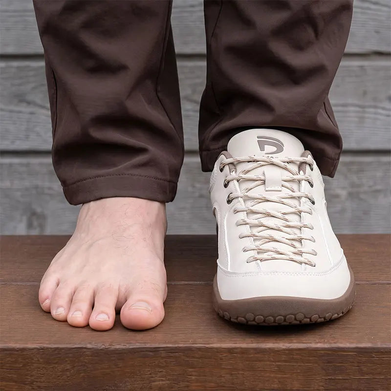 Dannto Veld I – 3E wide toe box barefoot shoes Beige, shown beside a bare foot