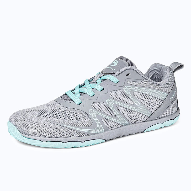 Gliss II - gray wide toe box barefoot shoes for women shown from a three quarter view