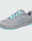 Gliss II - gray wide toe box barefoot shoes for women shown from a three quarter view