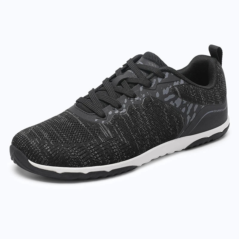 Gliss II Pro - black wide toe box barefoot shoes for women shown from a three quarter view