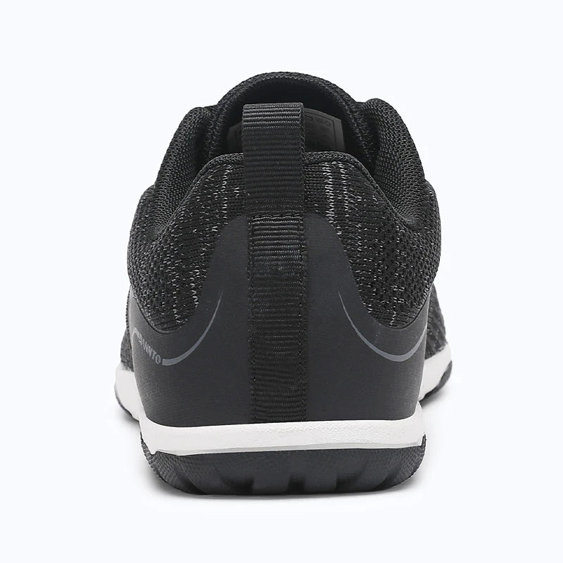 Gliss II Pro - black wide toe box barefoot shoes for women shown from the back