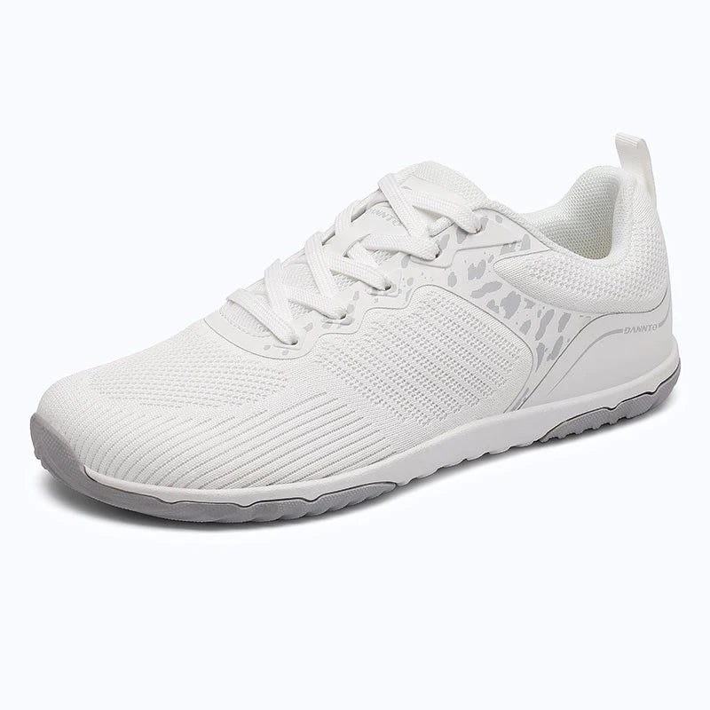 Gliss II Pro - white wide toe box barefoot shoes for women shown from a three quarter view