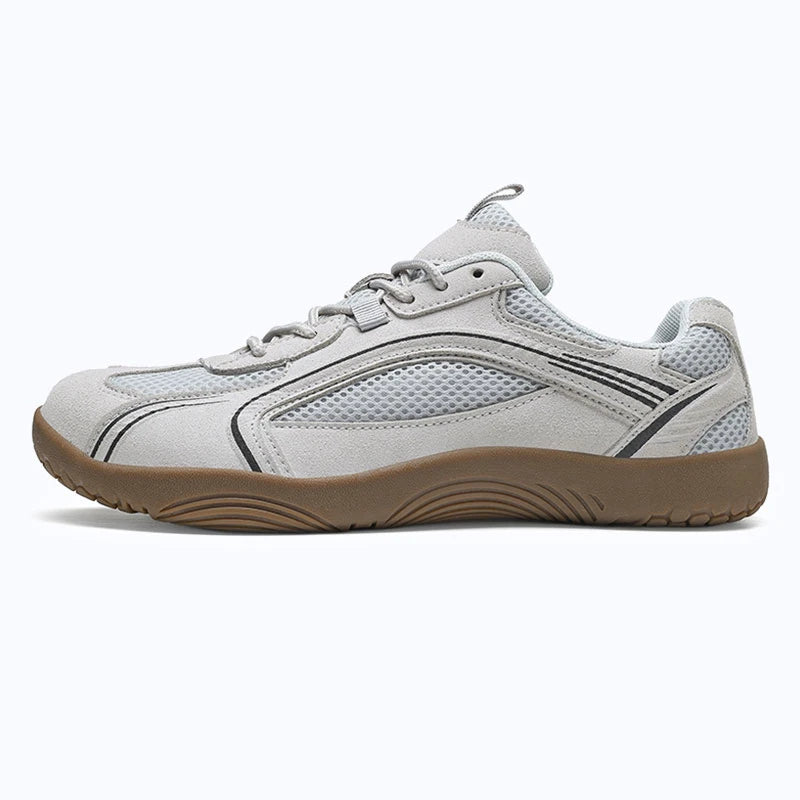 Dannto Aero N1 - 3E Wide Mesh Barefoot Shoes white shown being put on while sitting outdoors